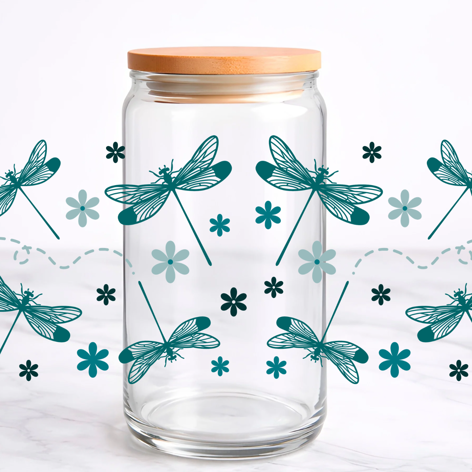 Clear glass jar with wooden lid and dragonfly design 